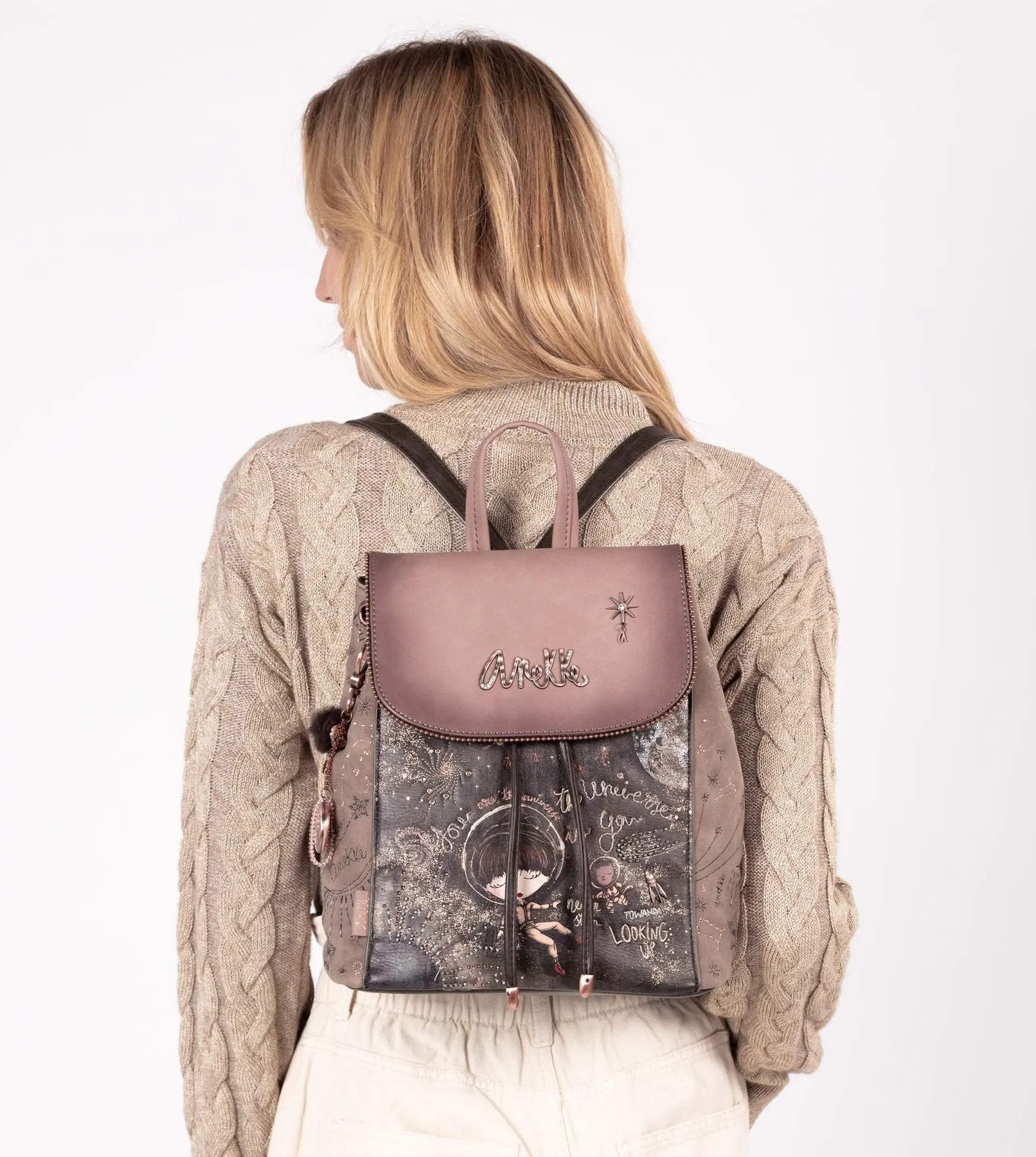 Pretty universe backpack with a flap closure and a printed design